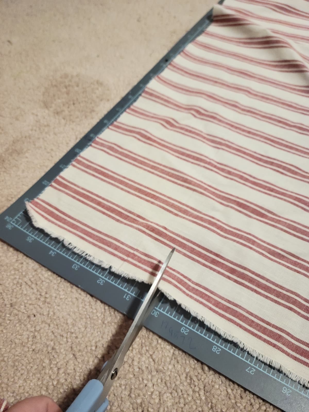 cutting red and white fabric