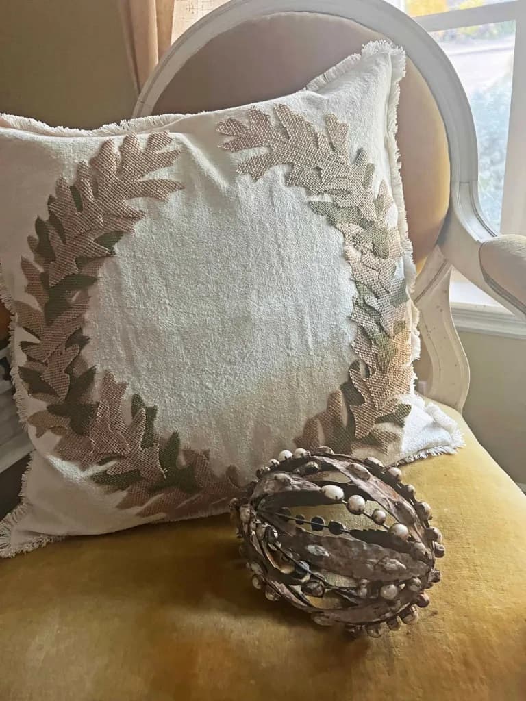 white pillow with leaves