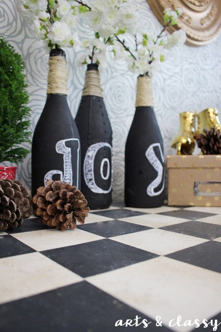 wine bottles painted black with joy written on them