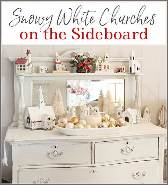 White sideboard with display of churches