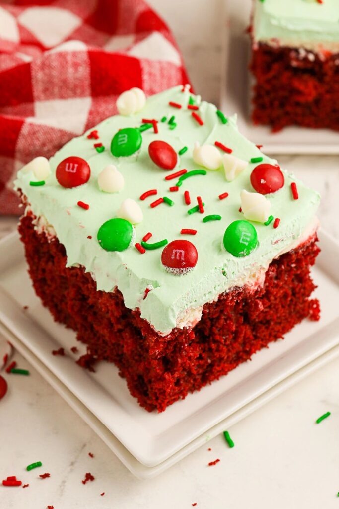 red cake with green icing and m&ms