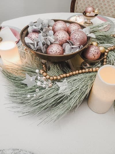 Silver bowl of pink ornaments