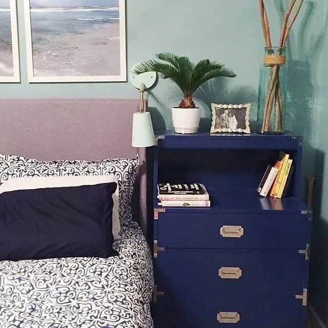 blue dresser by bed