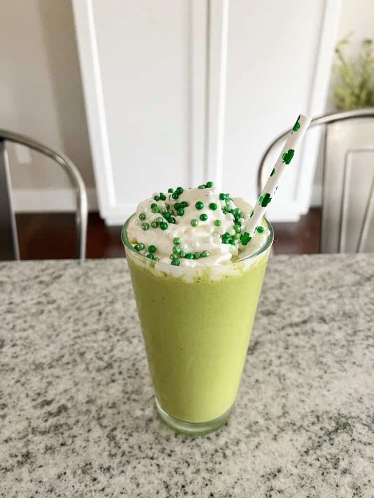 green shake with whipped cream and sprinkles