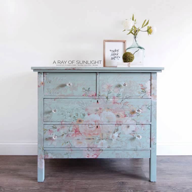 blue dresser with floral detail