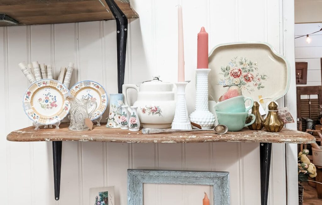 shelf of pastel vintage home decor