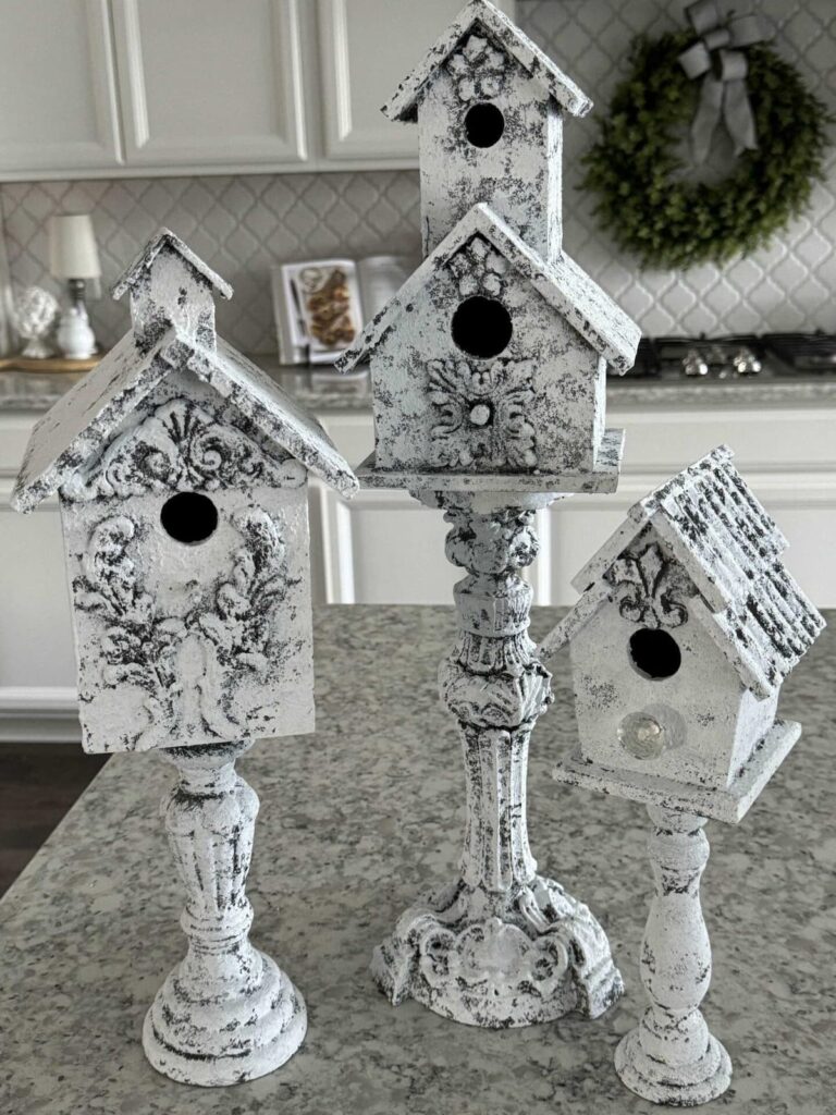 white birdhouses on stands