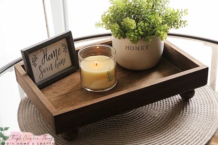 Wood tray with picture, candle, plant