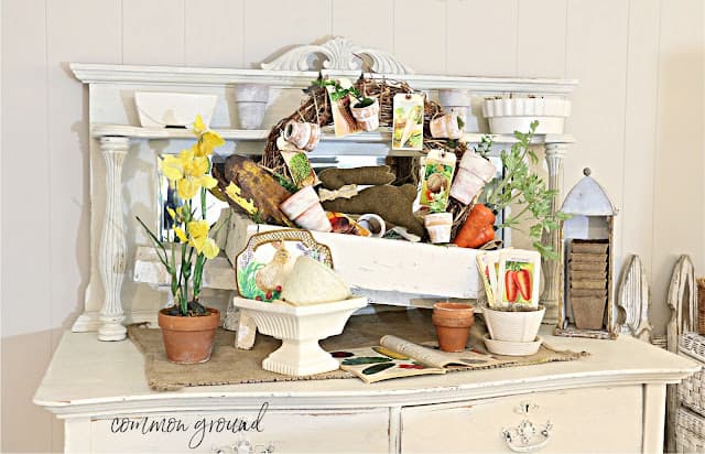 white sideboard with spring vignette