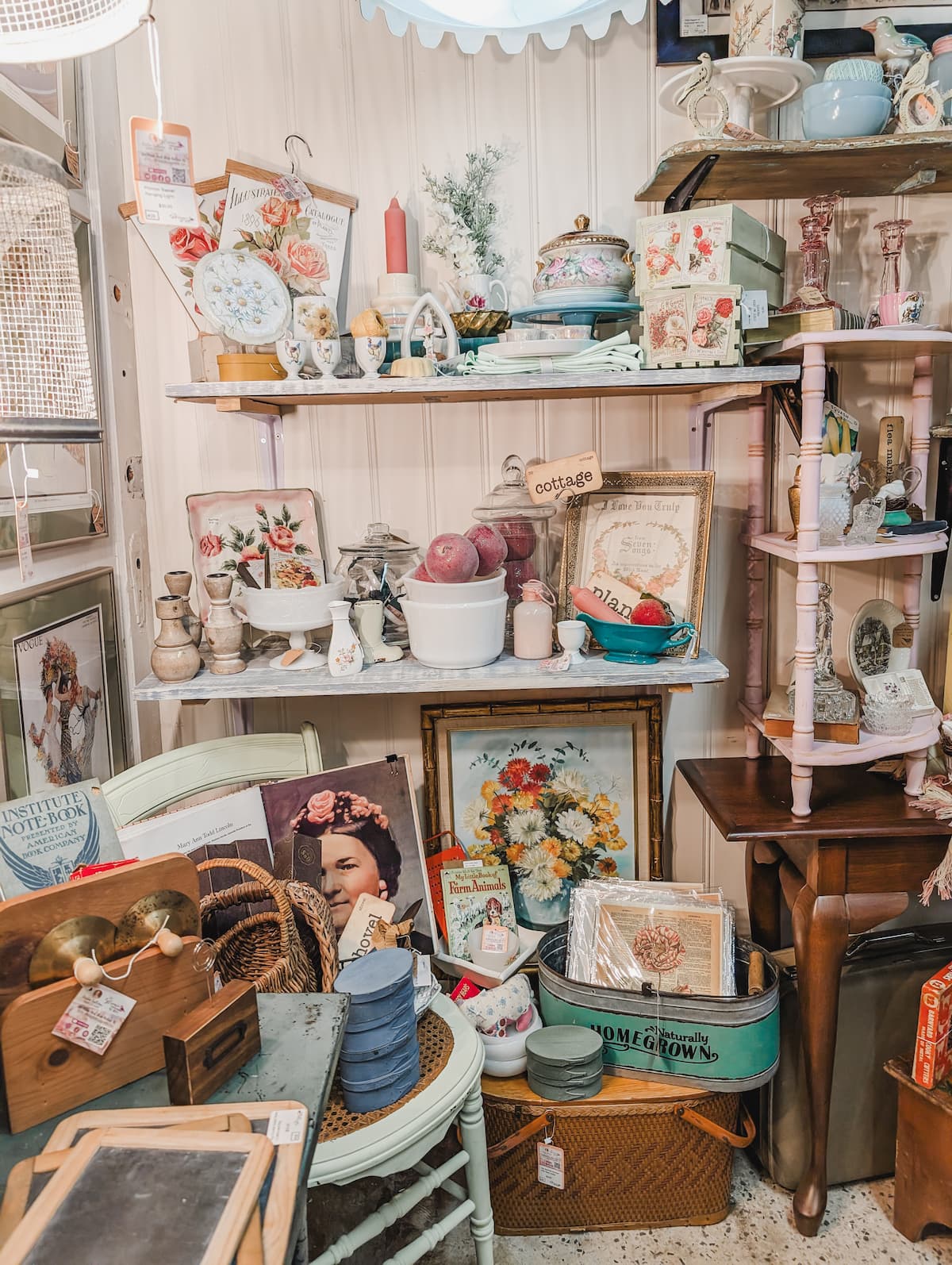 shelves in vintage booth with pastel and floral decor