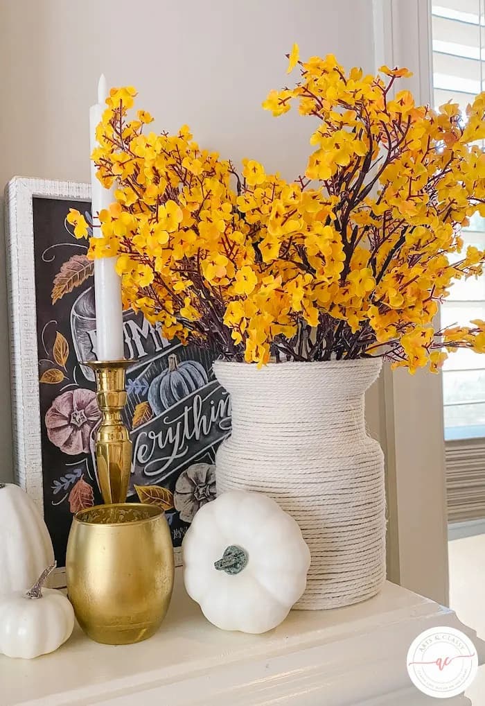 white vase with yellow flowers
