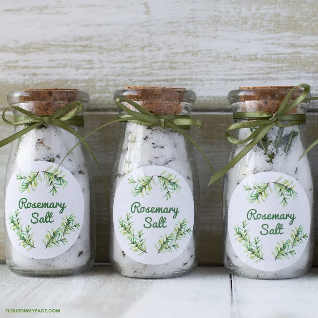 glass bottles of salt with rosemary