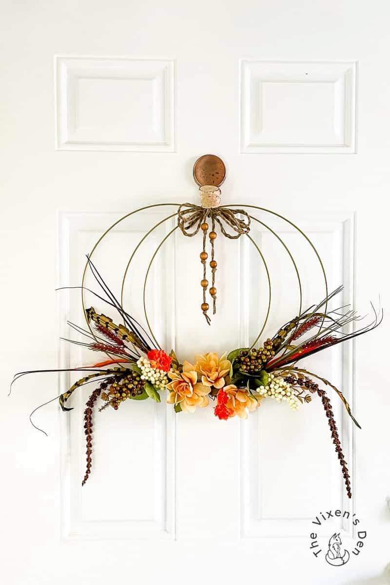 wire pumpkin wreath on door
