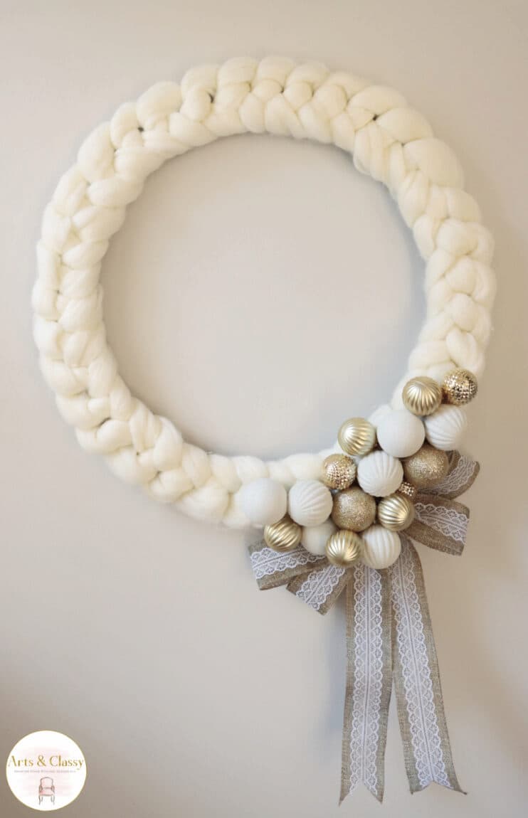white wreath with ornaments