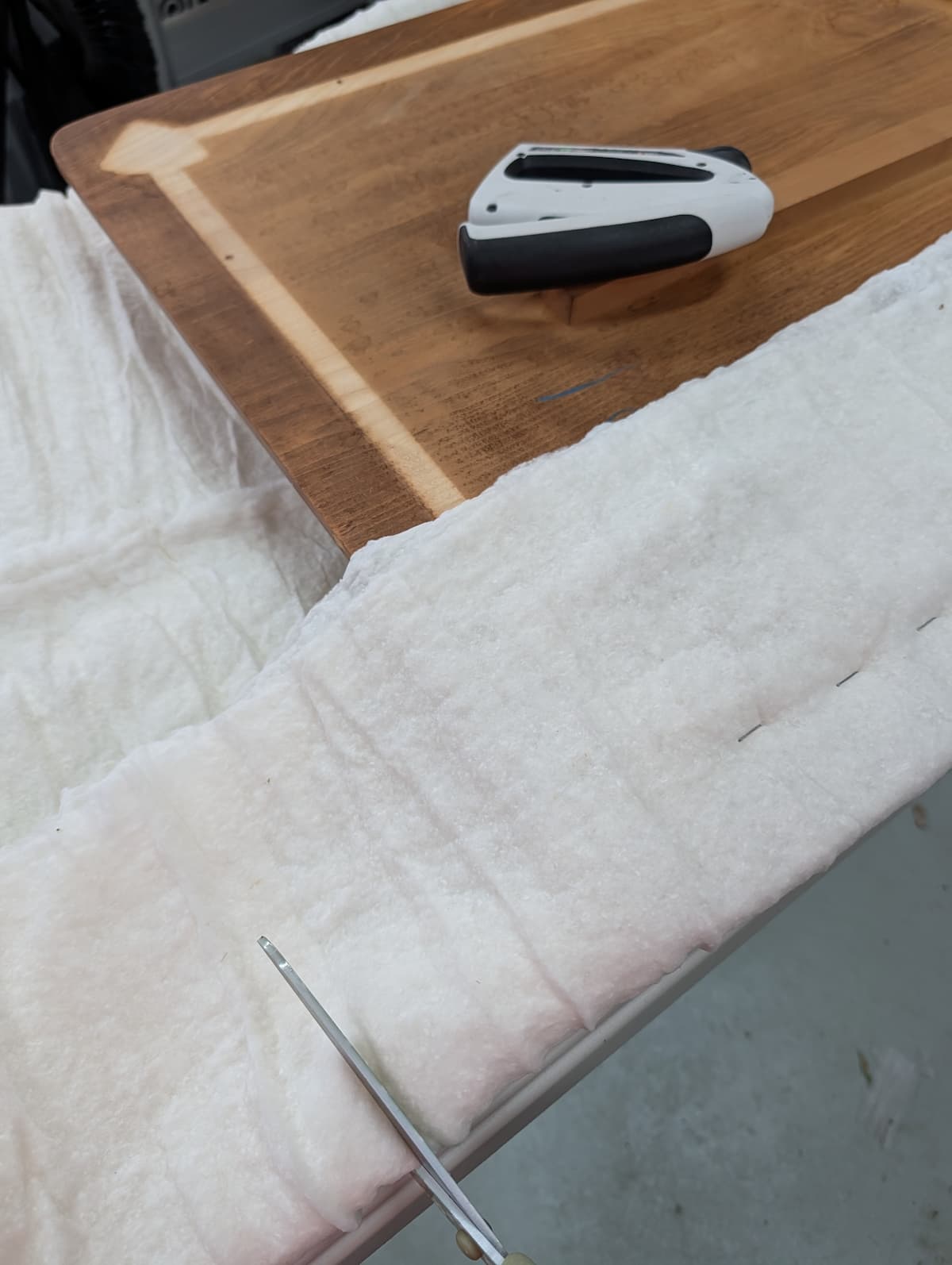 batting on table with stapler